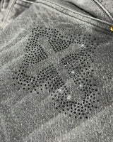 Jean baggy gris claro piedras cruz