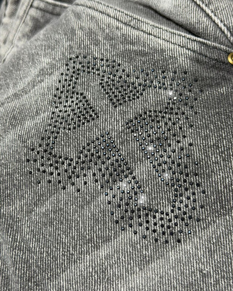 Jean baggy gris claro piedras cruz